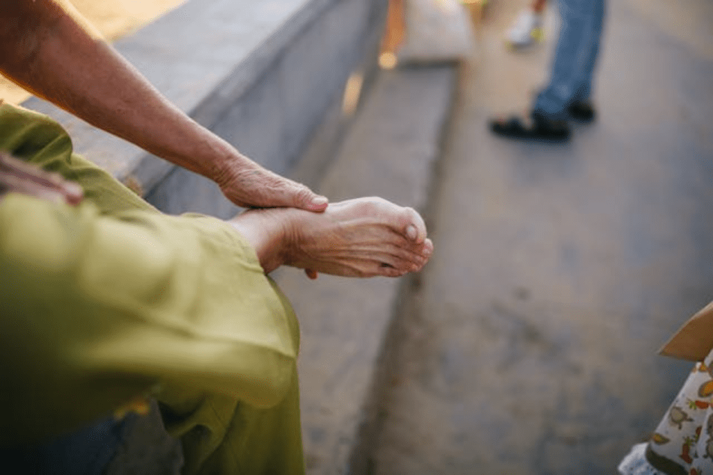 elder holding his foot